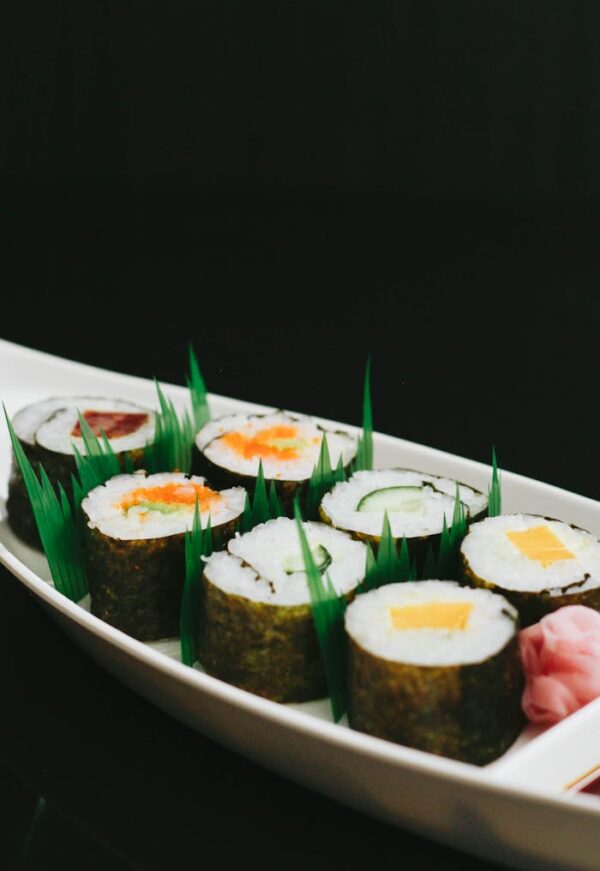 Selective Focus Photography Of Sushi On White Oval Plate